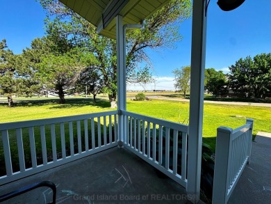 This charming home sits on a large lot with mature trees on the on Indianhead Golf Club in Nebraska - for sale on GolfHomes.com, golf home, golf lot