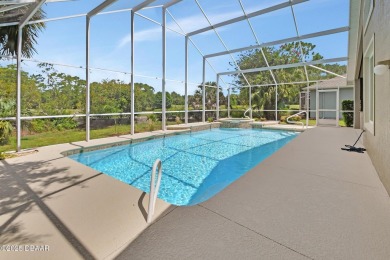 Discover this impeccably maintained pool home located on the on Plantation Bay Golf and Country Club in Florida - for sale on GolfHomes.com, golf home, golf lot