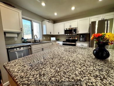 This charming home sits on a large lot with mature trees on the on Indianhead Golf Club in Nebraska - for sale on GolfHomes.com, golf home, golf lot
