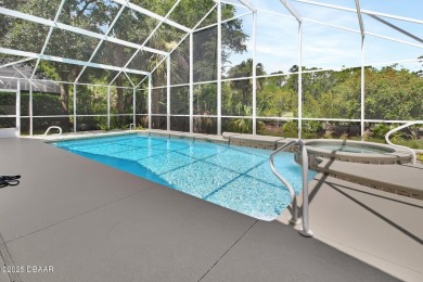 Discover this impeccably maintained pool home located on the on Plantation Bay Golf and Country Club in Florida - for sale on GolfHomes.com, golf home, golf lot