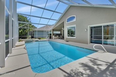 Discover this impeccably maintained pool home located on the on Plantation Bay Golf and Country Club in Florida - for sale on GolfHomes.com, golf home, golf lot