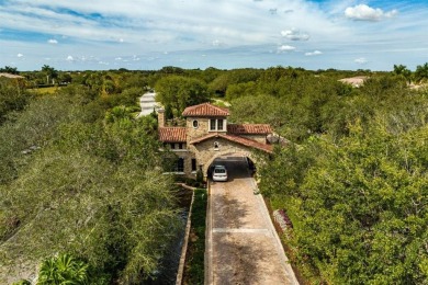 Behind a breathtaking guard-gated entrance, manicured on Parkland Golf Club in Florida - for sale on GolfHomes.com, golf home, golf lot