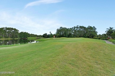 Discover this impeccably maintained pool home located on the on Plantation Bay Golf and Country Club in Florida - for sale on GolfHomes.com, golf home, golf lot