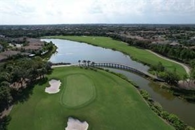 Behind a breathtaking guard-gated entrance, manicured on Parkland Golf Club in Florida - for sale on GolfHomes.com, golf home, golf lot