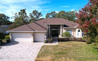 Beautifully situated 3+/3/3 pool home in upscale Silverthorn on Silverthorn Country Club in Florida - for sale on GolfHomes.com, golf home, golf lot