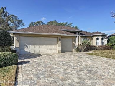 Beautifully situated 3+/3/3 pool home in upscale Silverthorn on Silverthorn Country Club in Florida - for sale on GolfHomes.com, golf home, golf lot