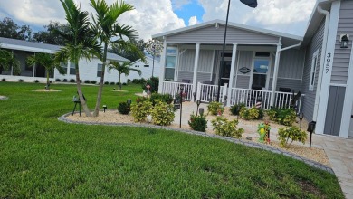 ABSOLUTELY STUNNING! This 2023 Palm Harbor Ventura Model home is on The Riverside Golf Club in Florida - for sale on GolfHomes.com, golf home, golf lot