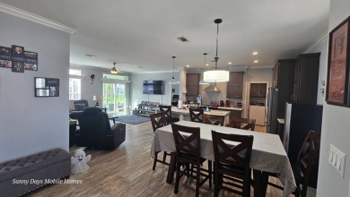 ABSOLUTELY STUNNING! This 2023 Palm Harbor Ventura Model home is on The Riverside Golf Club in Florida - for sale on GolfHomes.com, golf home, golf lot