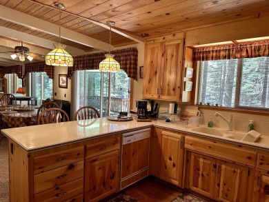 This beautifully maintained cabin features a spacious open floor on Lake Almanor Country Club in California - for sale on GolfHomes.com, golf home, golf lot
