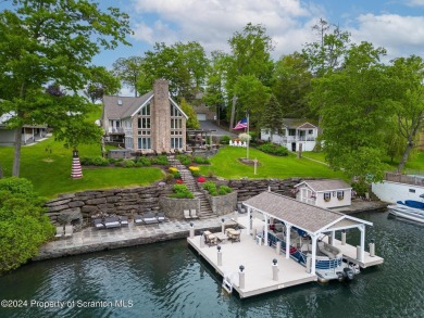 Indulge in the epitome of lakeside living with this exquisite on Scranton Canoe Club in Pennsylvania - for sale on GolfHomes.com, golf home, golf lot