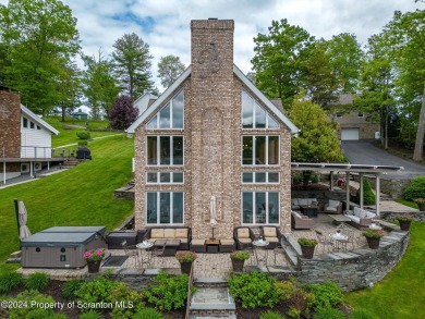 Indulge in the epitome of lakeside living with this exquisite on Scranton Canoe Club in Pennsylvania - for sale on GolfHomes.com, golf home, golf lot