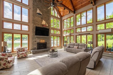 Indulge in the epitome of lakeside living with this exquisite on Scranton Canoe Club in Pennsylvania - for sale on GolfHomes.com, golf home, golf lot