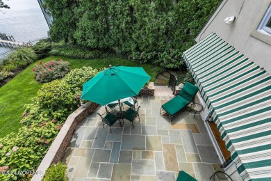 This stunning 5-bedroom, 5.5-bathroom English Tudor waterfront on Navesink Country Club in New Jersey - for sale on GolfHomes.com, golf home, golf lot