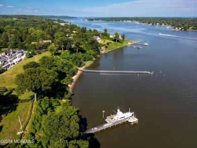 This stunning 5-bedroom, 5.5-bathroom English Tudor waterfront on Navesink Country Club in New Jersey - for sale on GolfHomes.com, golf home, golf lot