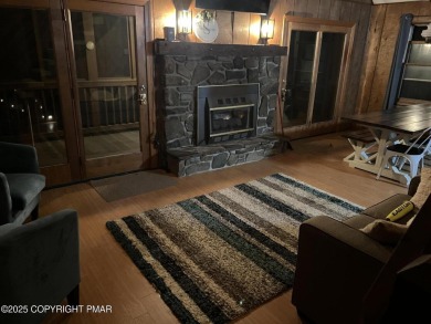 Welcome to this charming log-sided retreat offering 3 bedrooms on The Hideout Golf in Pennsylvania - for sale on GolfHomes.com, golf home, golf lot