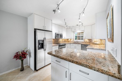 Experience serene living in this inviting 3-bedroom end-unit on  in Florida - for sale on GolfHomes.com, golf home, golf lot