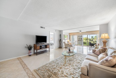 Experience serene living in this inviting 3-bedroom end-unit on  in Florida - for sale on GolfHomes.com, golf home, golf lot