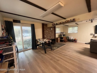 Welcome to this charming log-sided retreat offering 3 bedrooms on The Hideout Golf in Pennsylvania - for sale on GolfHomes.com, golf home, golf lot