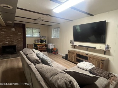 Welcome to this charming log-sided retreat offering 3 bedrooms on The Hideout Golf in Pennsylvania - for sale on GolfHomes.com, golf home, golf lot