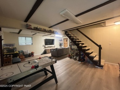 Welcome to this charming log-sided retreat offering 3 bedrooms on The Hideout Golf in Pennsylvania - for sale on GolfHomes.com, golf home, golf lot