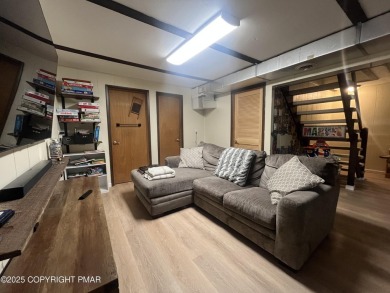 Welcome to this charming log-sided retreat offering 3 bedrooms on The Hideout Golf in Pennsylvania - for sale on GolfHomes.com, golf home, golf lot