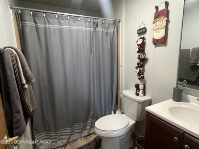 Welcome to this charming log-sided retreat offering 3 bedrooms on The Hideout Golf in Pennsylvania - for sale on GolfHomes.com, golf home, golf lot