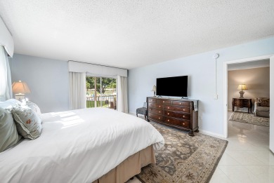 Experience serene living in this inviting 3-bedroom end-unit on  in Florida - for sale on GolfHomes.com, golf home, golf lot