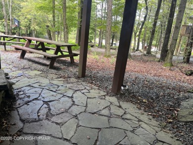 Welcome to this charming log-sided retreat offering 3 bedrooms on The Hideout Golf in Pennsylvania - for sale on GolfHomes.com, golf home, golf lot