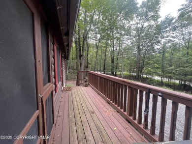Welcome to this charming log-sided retreat offering 3 bedrooms on The Hideout Golf in Pennsylvania - for sale on GolfHomes.com, golf home, golf lot