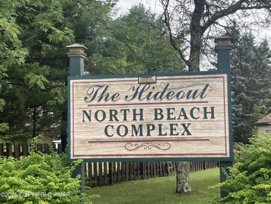 Welcome to this charming log-sided retreat offering 3 bedrooms on The Hideout Golf in Pennsylvania - for sale on GolfHomes.com, golf home, golf lot