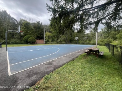 Welcome to this charming log-sided retreat offering 3 bedrooms on The Hideout Golf in Pennsylvania - for sale on GolfHomes.com, golf home, golf lot