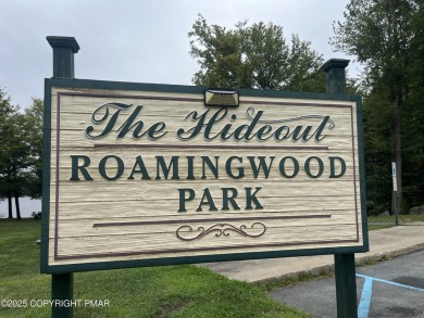 Welcome to this charming log-sided retreat offering 3 bedrooms on The Hideout Golf in Pennsylvania - for sale on GolfHomes.com, golf home, golf lot