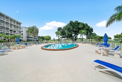 Experience serene living in this inviting 3-bedroom end-unit on  in Florida - for sale on GolfHomes.com, golf home, golf lot