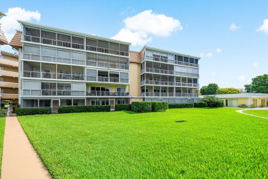 Experience serene living in this inviting 3-bedroom end-unit on  in Florida - for sale on GolfHomes.com, golf home, golf lot