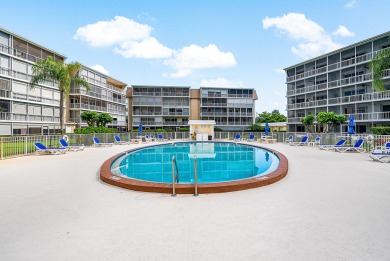 Experience serene living in this inviting 3-bedroom end-unit on  in Florida - for sale on GolfHomes.com, golf home, golf lot