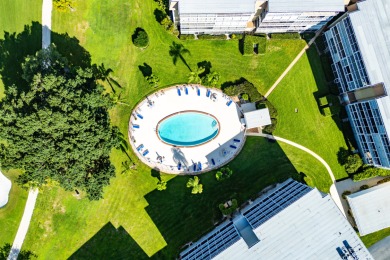 Experience serene living in this inviting 3-bedroom end-unit on  in Florida - for sale on GolfHomes.com, golf home, golf lot