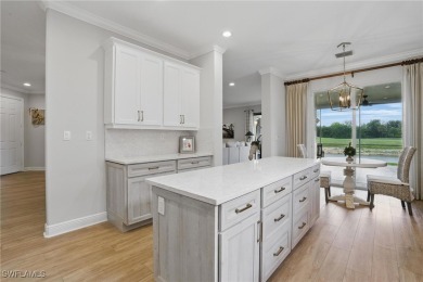Welcome home to this elegant $100k remodel, first-floor on Quail West Golf and Country Club in Florida - for sale on GolfHomes.com, golf home, golf lot