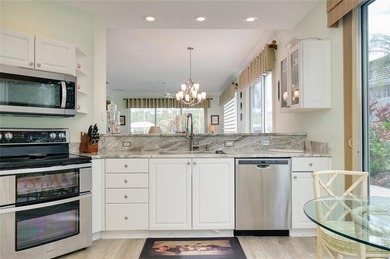 Maintenance-Free Living with Peaceful Water Views in Rosedale on Rosedale Golf and Tennis Club in Florida - for sale on GolfHomes.com, golf home, golf lot