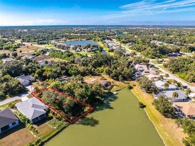 Make your Florida dream come true on this water view lot on a on Rotonda Golf and Country Club The Palms Course in Florida - for sale on GolfHomes.com, golf home, golf lot