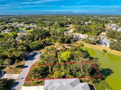 Make your Florida dream come true on this water view lot on a on Rotonda Golf and Country Club The Palms Course in Florida - for sale on GolfHomes.com, golf home, golf lot