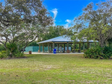 Make your Florida dream come true on this water view lot on a on Rotonda Golf and Country Club The Palms Course in Florida - for sale on GolfHomes.com, golf home, golf lot