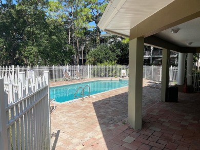 Discover a unique opportunity to acquire two adjoining tri-level on Baypoint Golf Club in Florida - for sale on GolfHomes.com, golf home, golf lot