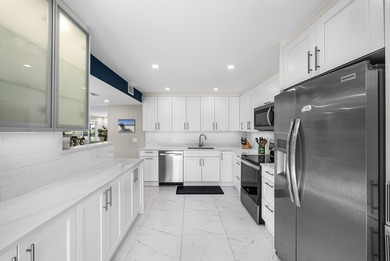 Welcome to this inviting 1st‑floor home showcasing serene on Quail Ridge Golf Course and Country Club in Florida - for sale on GolfHomes.com, golf home, golf lot