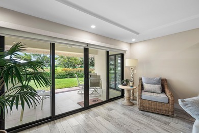 Welcome to this inviting 1st‑floor home showcasing serene on Quail Ridge Golf Course and Country Club in Florida - for sale on GolfHomes.com, golf home, golf lot