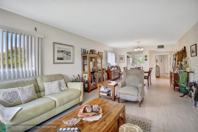 This immaculate corner unit in a newer building of a great 55+ on Flamingo Lakes Country Club in Florida - for sale on GolfHomes.com, golf home, golf lot
