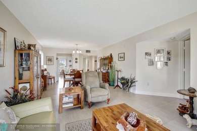 This immaculate corner unit in a newer building of a great 55+ on Flamingo Lakes Country Club in Florida - for sale on GolfHomes.com, golf home, golf lot