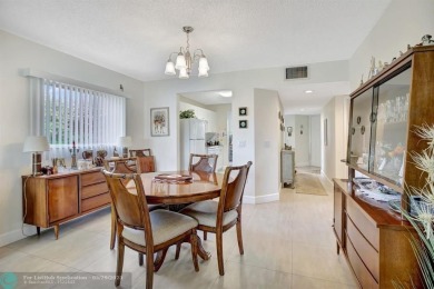 This immaculate corner unit in a newer building of a great 55+ on Flamingo Lakes Country Club in Florida - for sale on GolfHomes.com, golf home, golf lot