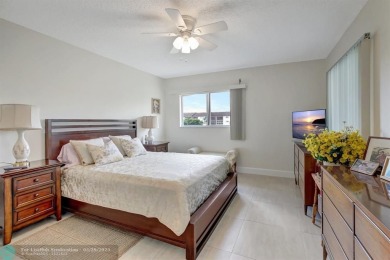 This immaculate corner unit in a newer building of a great 55+ on Flamingo Lakes Country Club in Florida - for sale on GolfHomes.com, golf home, golf lot