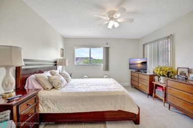 This immaculate corner unit in a newer building of a great 55+ on Flamingo Lakes Country Club in Florida - for sale on GolfHomes.com, golf home, golf lot