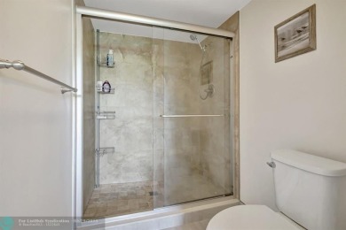 This immaculate corner unit in a newer building of a great 55+ on Flamingo Lakes Country Club in Florida - for sale on GolfHomes.com, golf home, golf lot